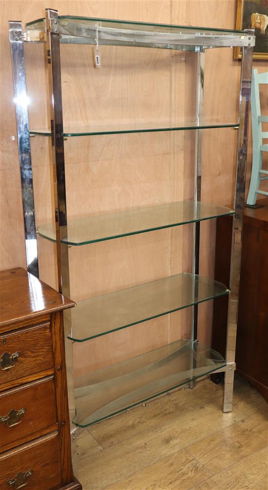 A contemporary chrome and glass shelving unit W.90cm